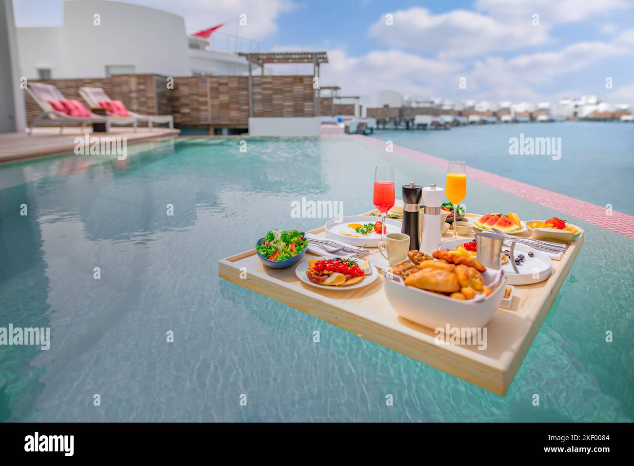 Breakfast tray in swimming pool, floating breakfast in luxury hotel