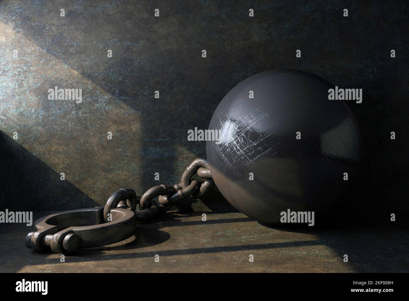 leg shackles with a ball illuminated by a beam of light in a dungeon