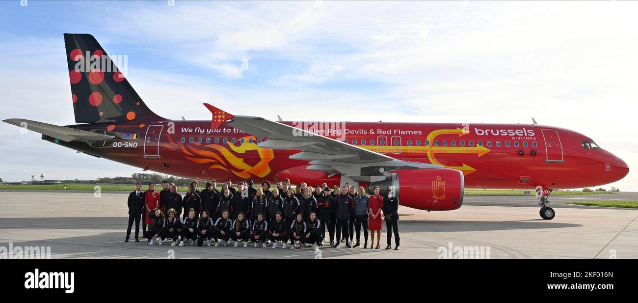 Zaventem. 15 November 2022, Belgium team players pose in front of the plane at the presentation of the new so-called Trident of Brussels Airlines at the departure of Belgian national soccer team the Red Devils from Brussels Airport, Tuesday 15 November 2022, in Zaventem. The Red Devils fly to Kuwait today, for a training camp ahead of the FIFA World Cup 2022. The airplane is painted in special colours for the Belgian national soccer team. BELGA PHOTO ERIC LALMAND Stock Photo