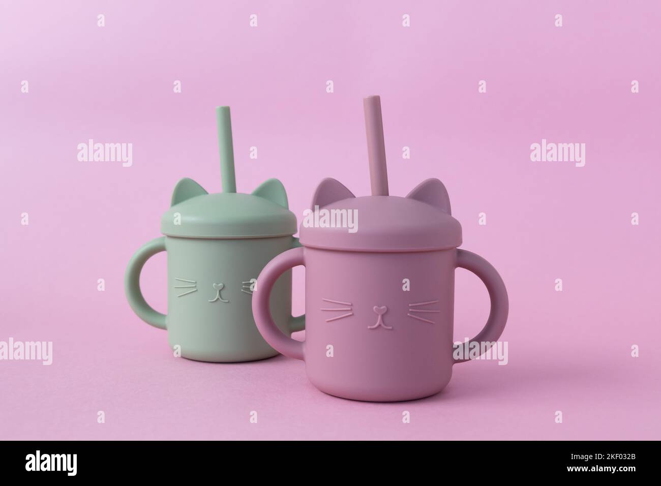 https://c8.alamy.com/comp/2KF032B/pastel-green-and-pink-sippy-cup-with-straw-silicone-first-soft-cup-for-toddler-baby-tableware-nutrition-and-feeding-concept-free-space-for-text-2KF032B.jpg