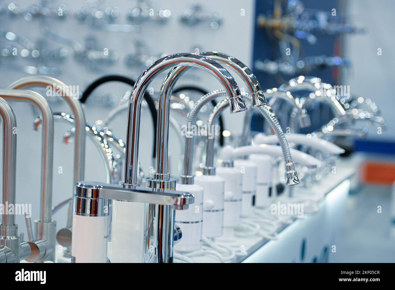 Silver kitchen faucet set with instantaneous water heater Stock Photo