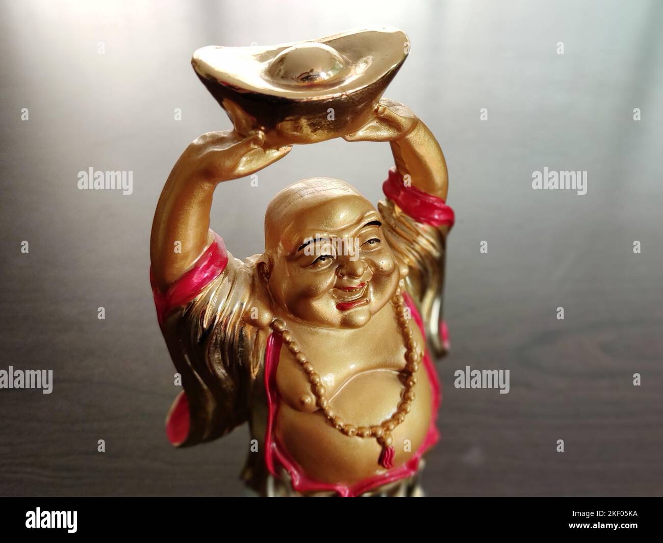 Laughing buddha idol Stock Photo Alamy
