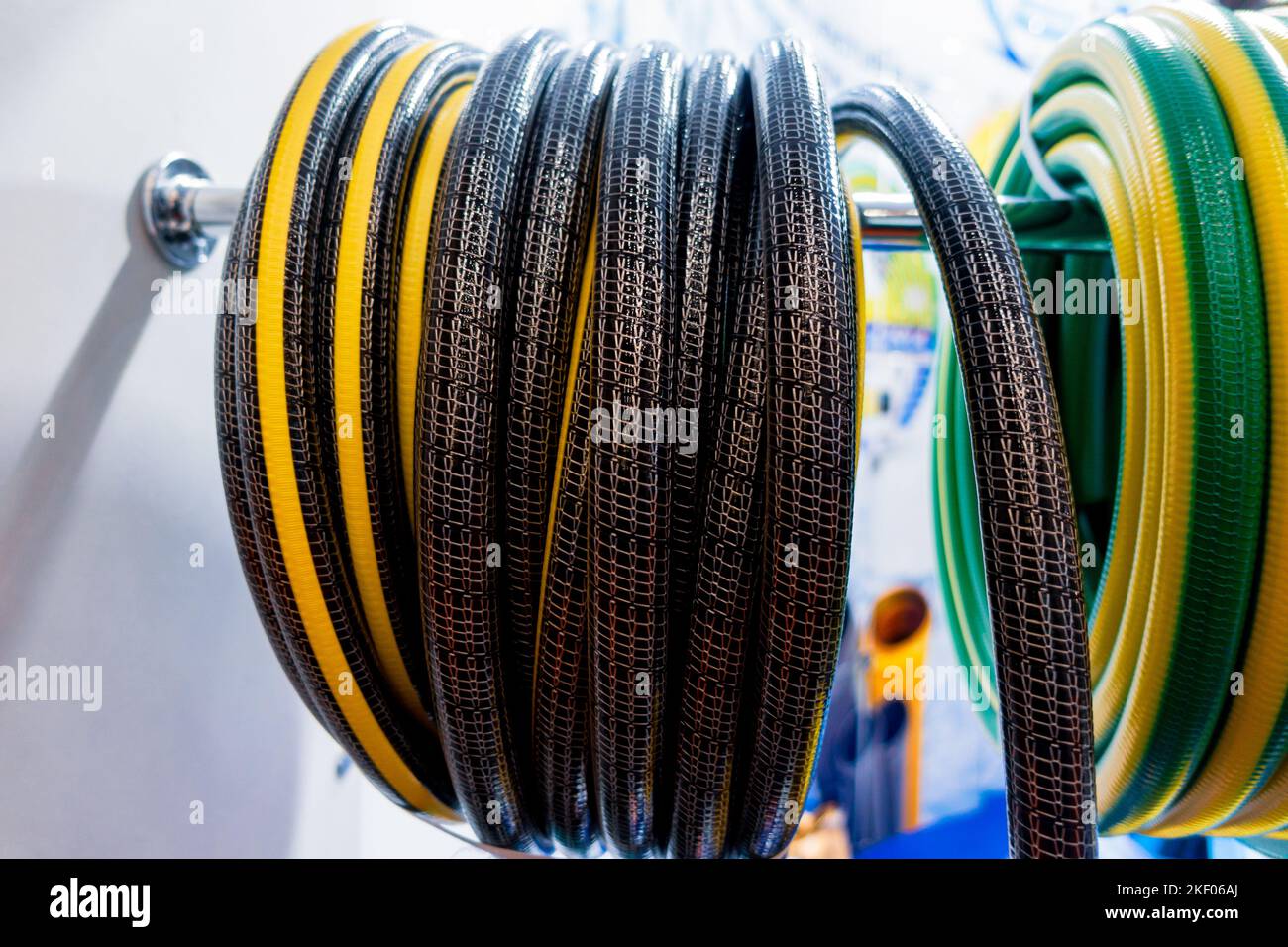 Roll of flexible hose rings. Flexible hose wrapped around the wheel. Stock Photo