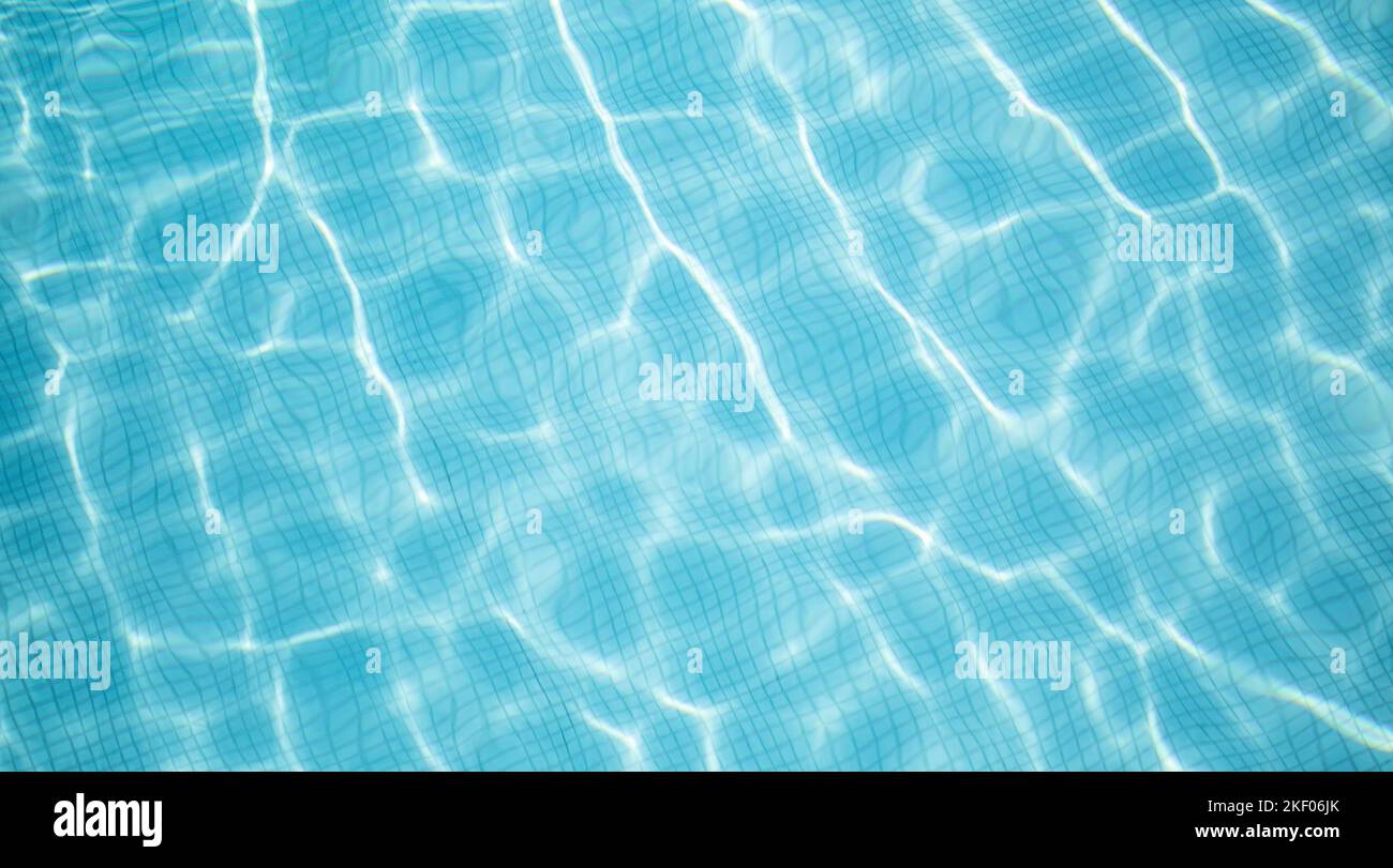 Beautiful relaxing swimming pool water sun reflection background. Ripple water texture background, natural sunlight. Abstract artistic water surface Stock Photo