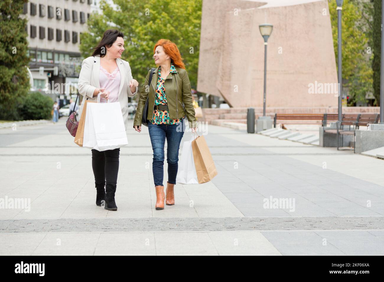 Two people walking street hi-res stock photography and images - Alamy