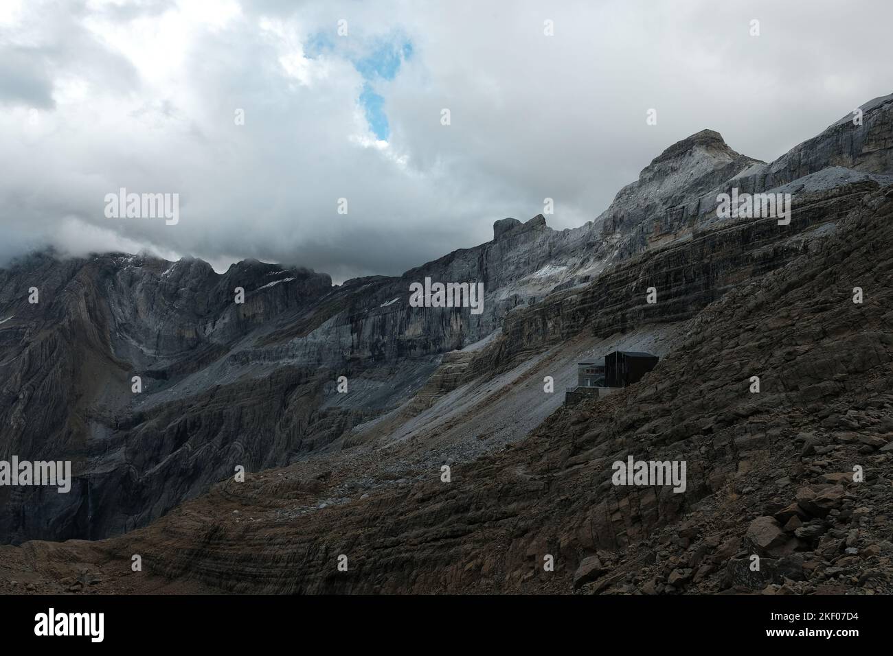 The Refuge des Sarradets (Midground) and le Casque du Marbore in the French Pyrenees Stock Photo