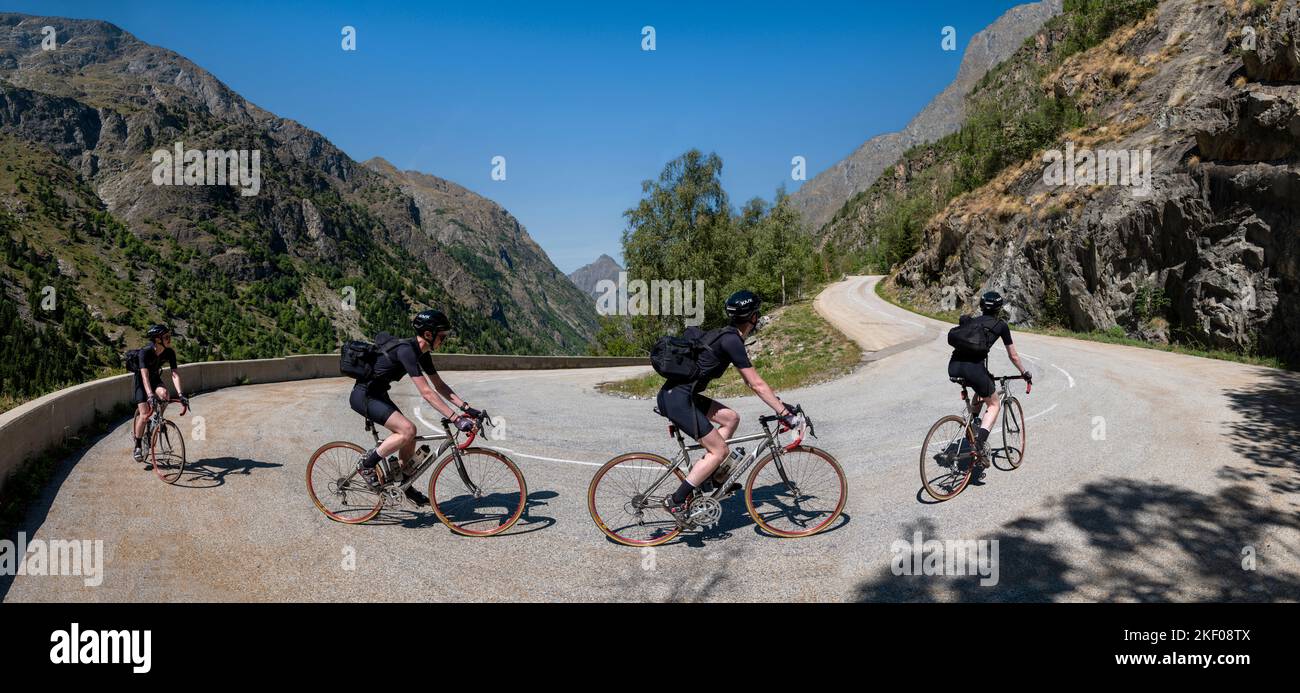 Composite image of Male road cyclist climbing the alpine road to Saint-Christophe-en-Oisans, French alps. Stock Photo