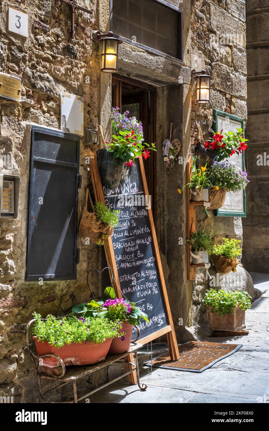 Signboard outside restaurant on Via Giuseppe Maffei in hilltop town of Cortona in Tuscany, Italy Stock Photo