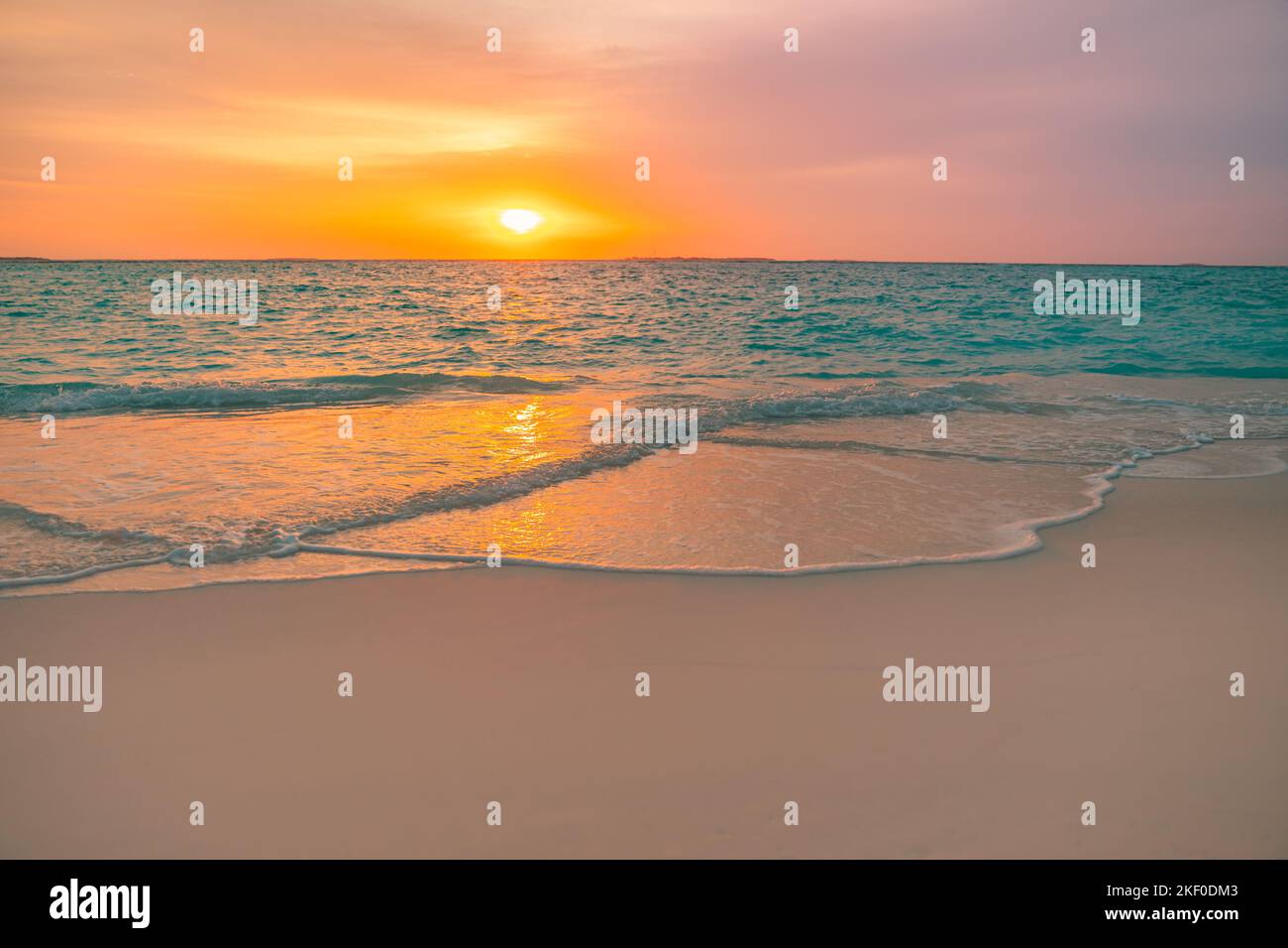 Beautiful sunrise beach. Exotic dramatic shore waves on sand, sea surface. Closeup tropical Mediterranean dream sunset sky. Peaceful tranquil relax Stock Photo