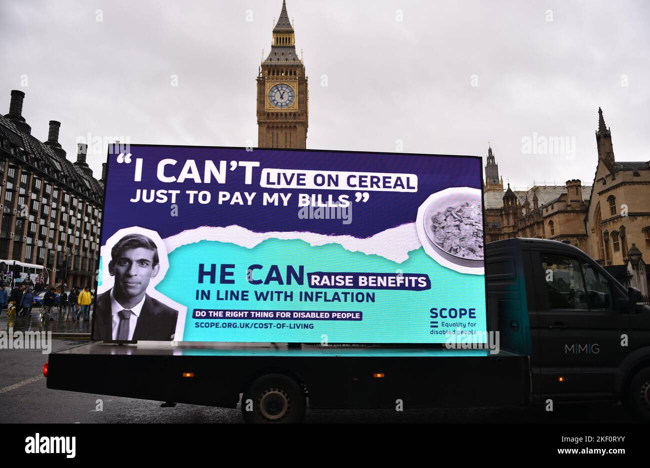 London, UK, 15th Nov 2022. A van carries a digital billboard, seen opposite the Houses Of Parliament, with a picture of Prime Minister Rishi Sunak  by Scope charity organization, demanding more government support, as the cost of living crisis is hitting disabled people. Credit: Thomas Krych/Alamy Live News Stock Photo