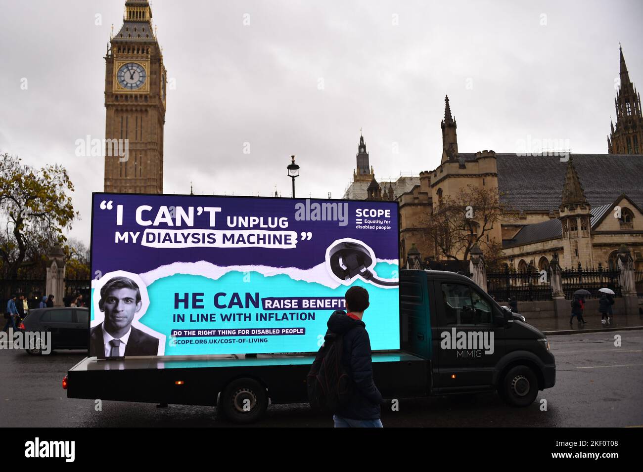 London, UK, 15th Nov 2022. A van carries a digital billboard, seen opposite the Houses Of Parliament, with a picture of Prime Minister Rishi Sunak  by Scope charity organization, demanding more government support, as the cost of living crisis is hitting disabled people. Credit: Thomas Krych/Alamy Live News Stock Photo