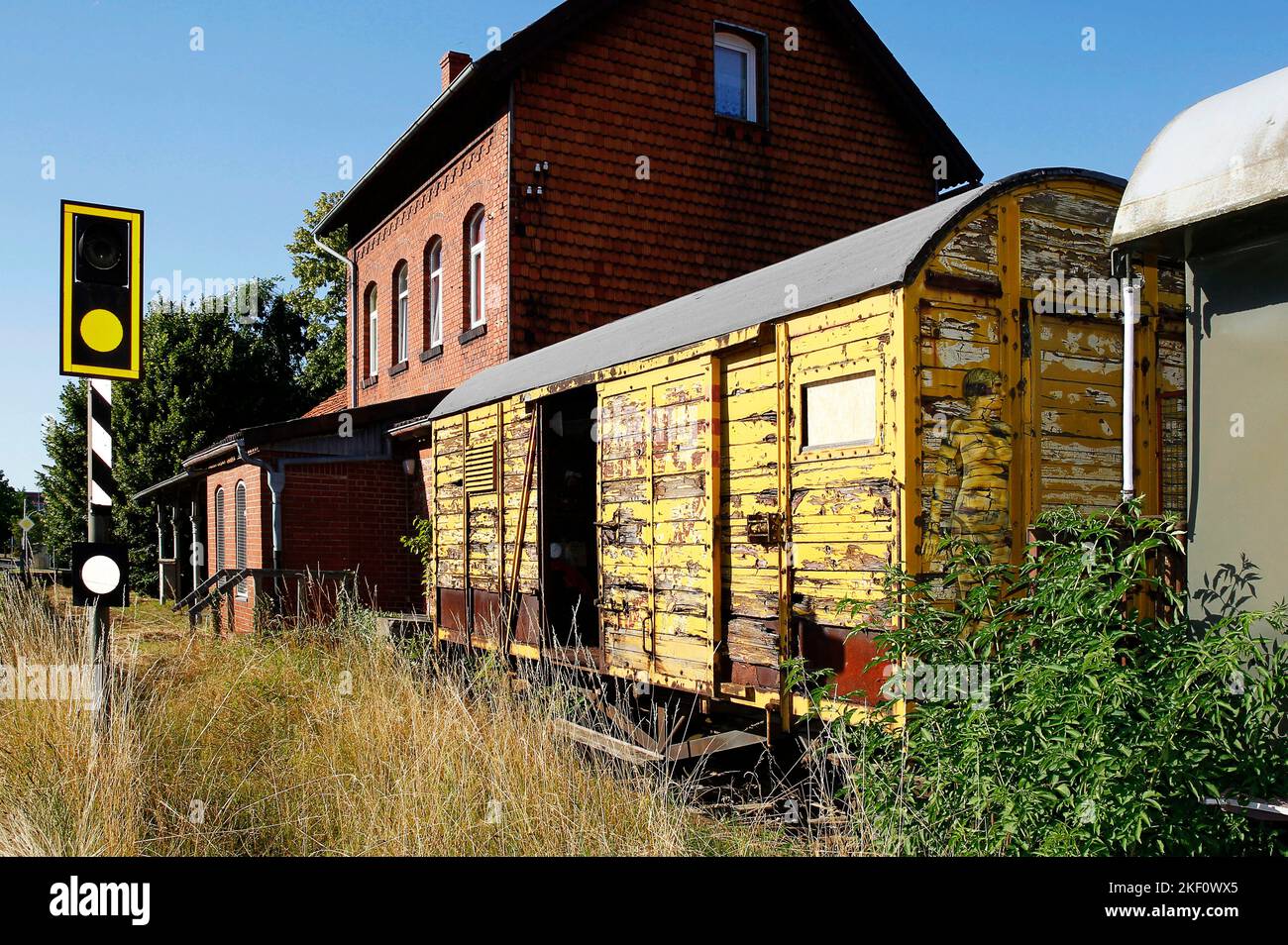 From the COLOR BODIES calendar 2023 - camouflage art bodypainting: railway carriage bodypainting with model Anna-Lena at a disused train station in SalzInhibitororf. A project by the photographer Tschiponnique Skupin and the bodypainter Jörg Düsterwald. Stock Photo