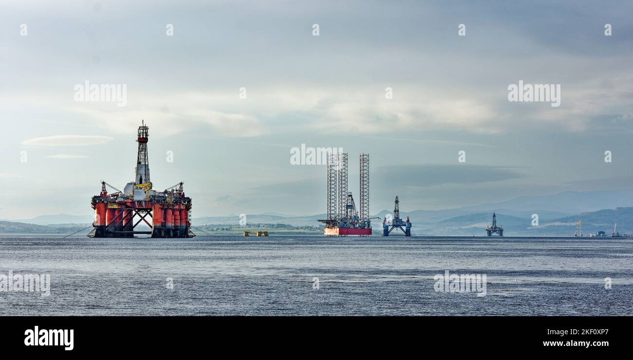 Cromarty Firth Scotland four decommissioned oil rigs lying offshore from Nigg Stock Photo