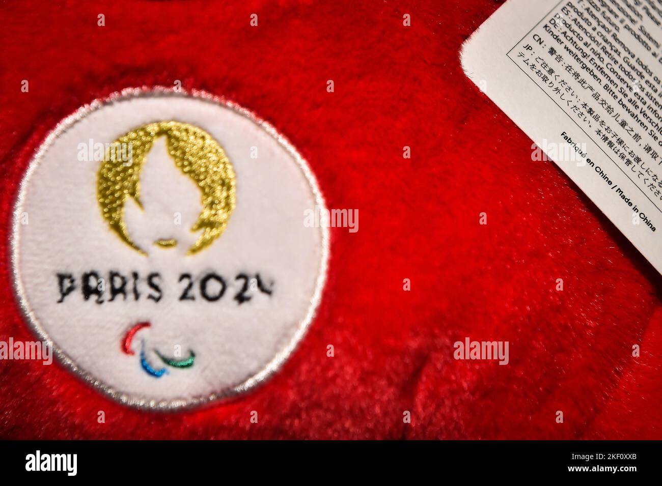 This photograph shows the Paris 2024 logo on a plush representing the