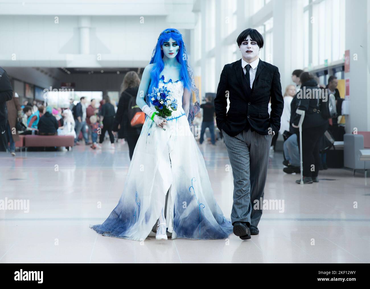 BIRMINGHAM, UK - NOVEMBER 13, 2022.  A bride and groom pair of cosplayers dressed as Timothy Burton's Corpse Bride and Dead Boy Walking at MCM Birming Stock Photo
