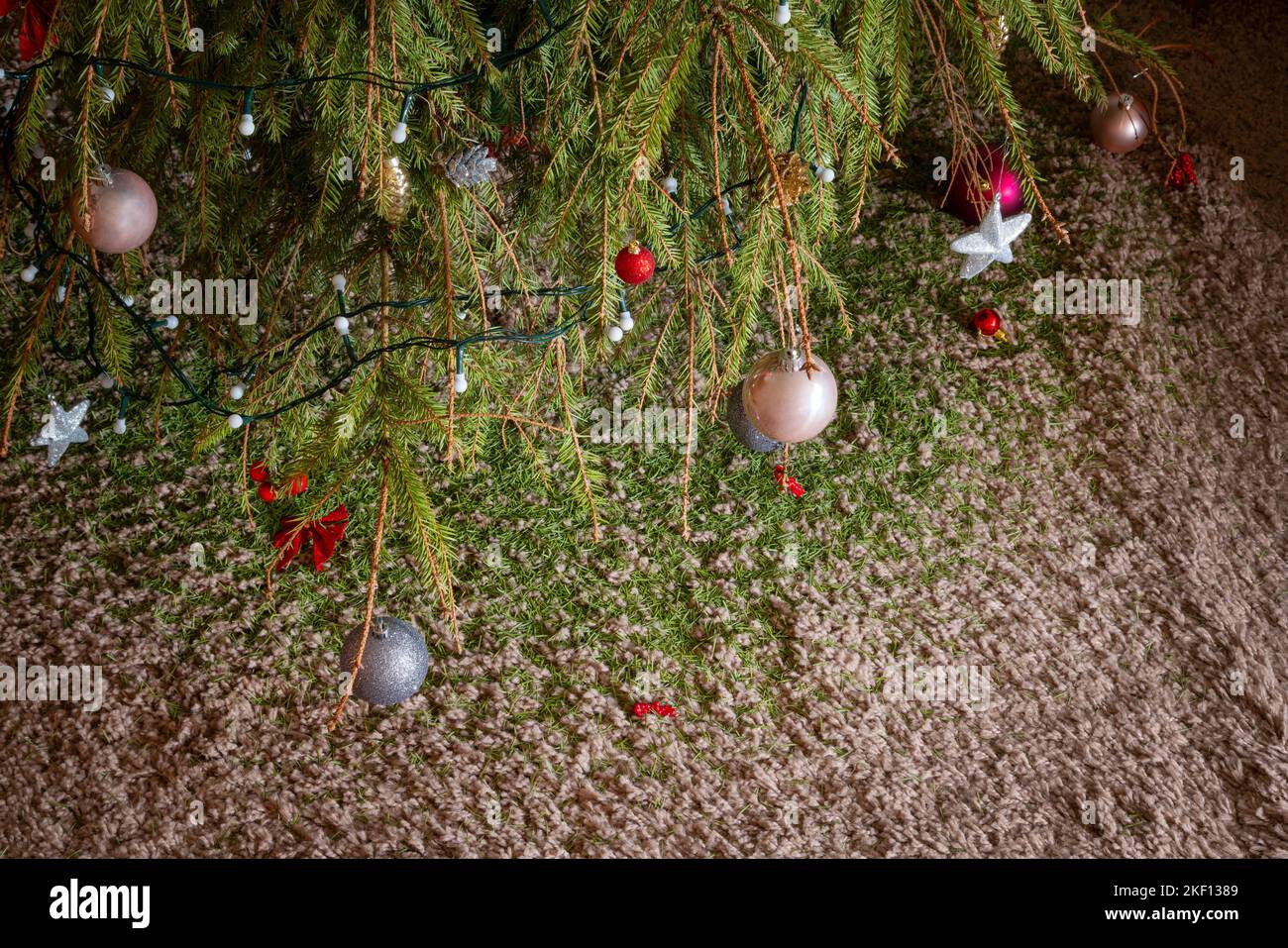 Little Santa stands next to an Armenian wooden Christmas tree toy. There is  a small toy deer near the tree. in miniature. Christmas decorations Stock  Photo - Alamy