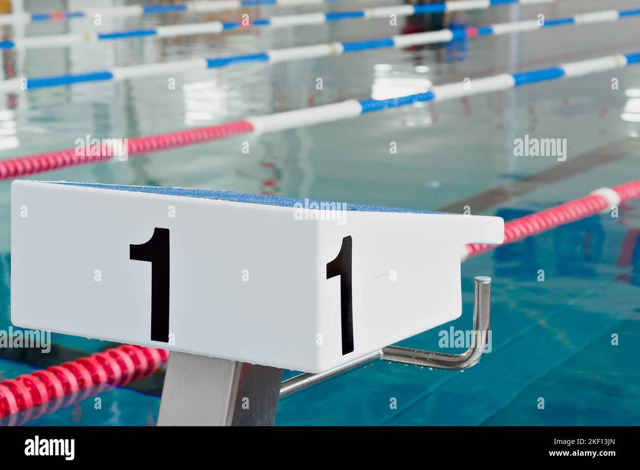 Starting table with numbers for diving in Olympic pool. Swimming pool