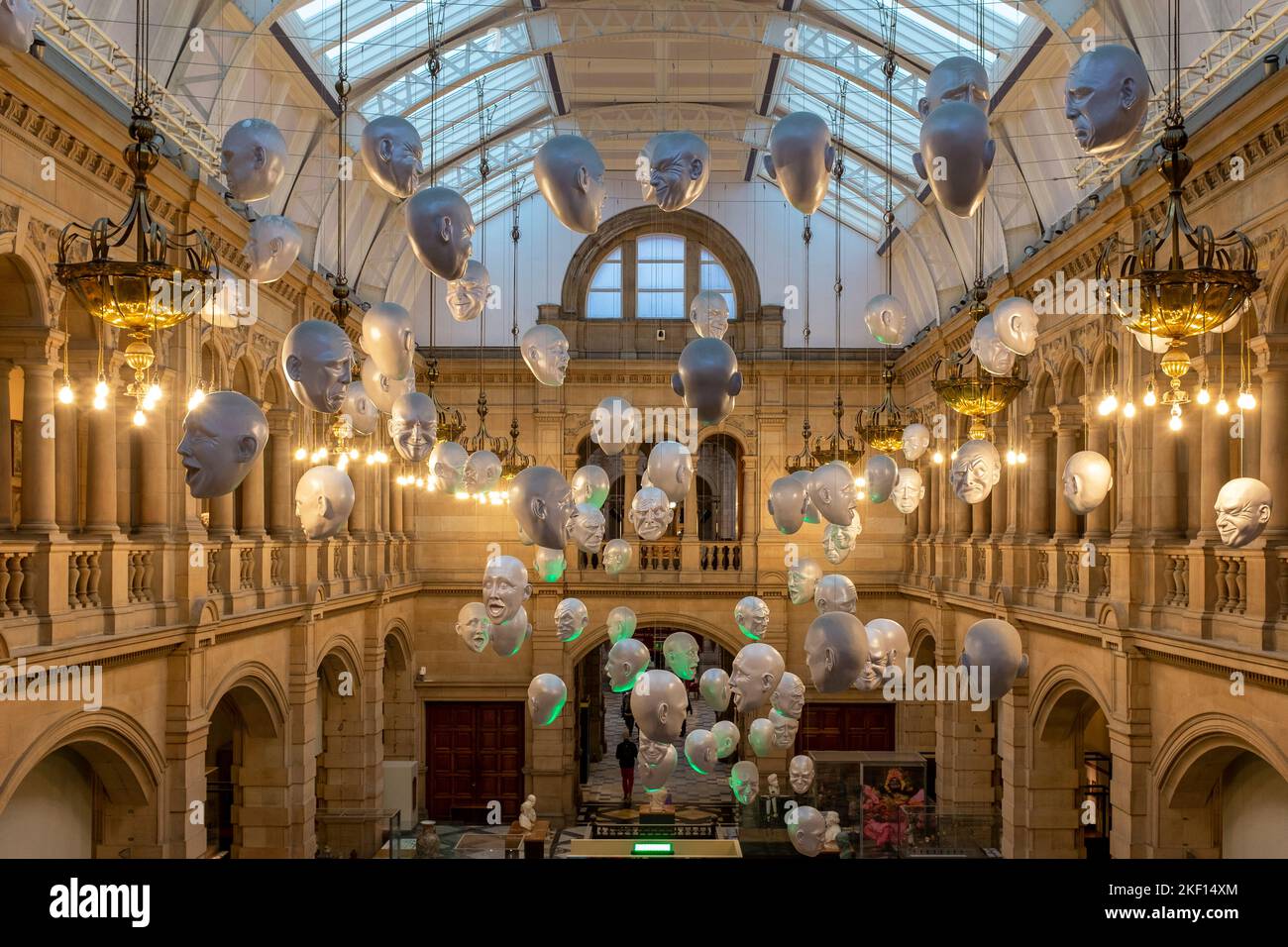 Hanging heads art exhibition in one of the foyers of Kelvingrove Art