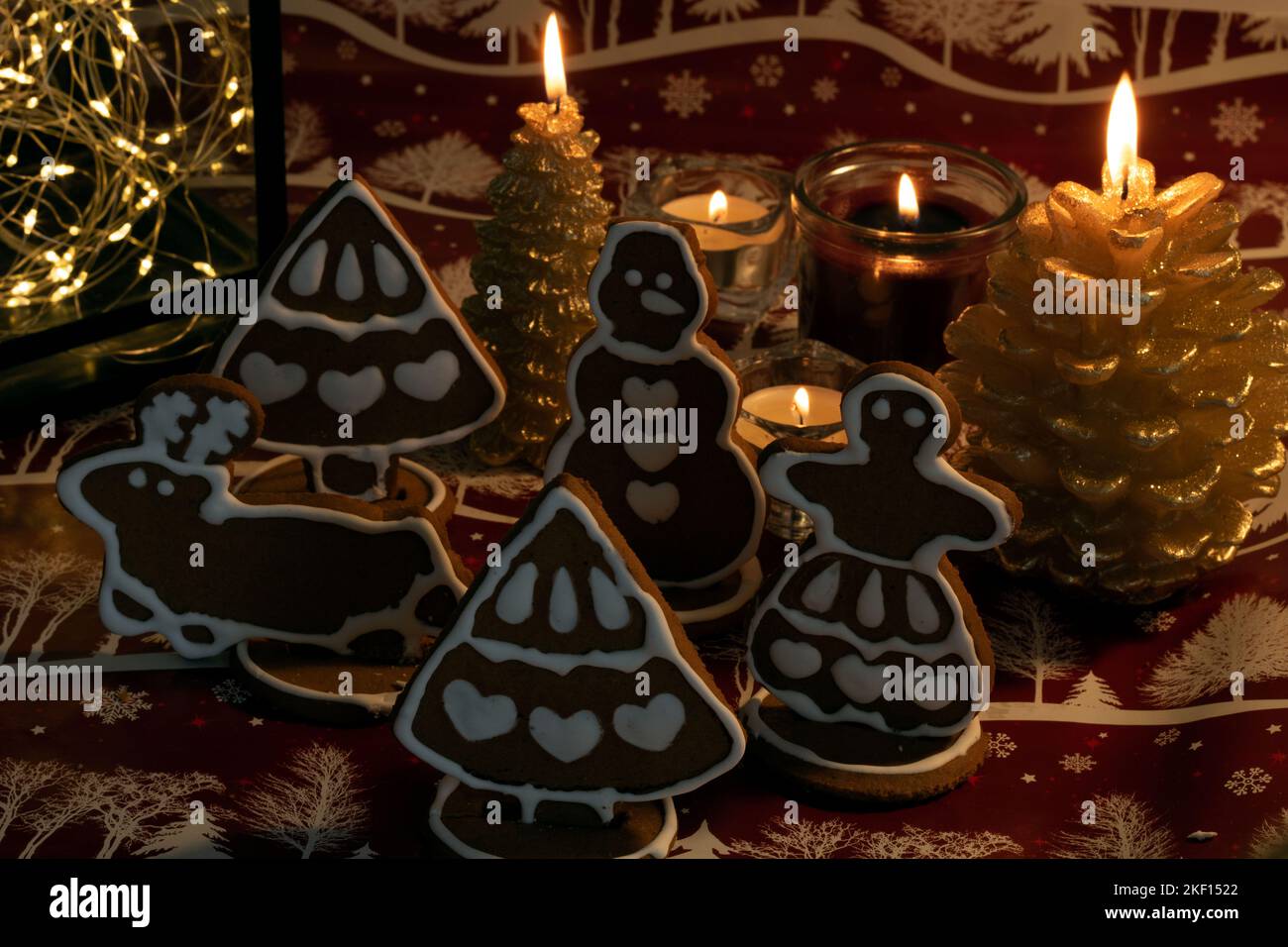 photo Christmas gingerbread and burning candles on the table Stock Photo