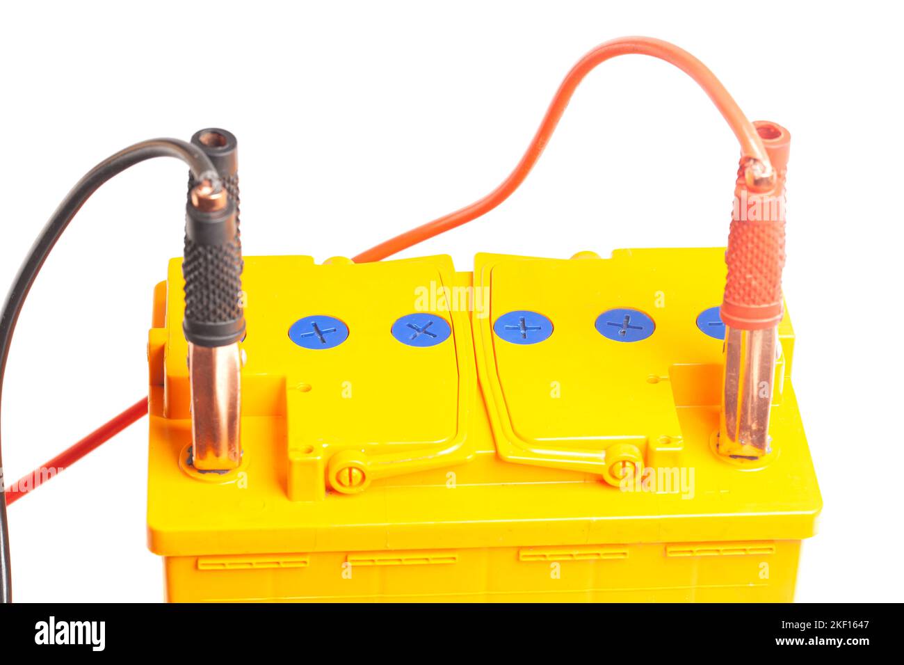 Charging the car acid battery. The charger terminals are connected to