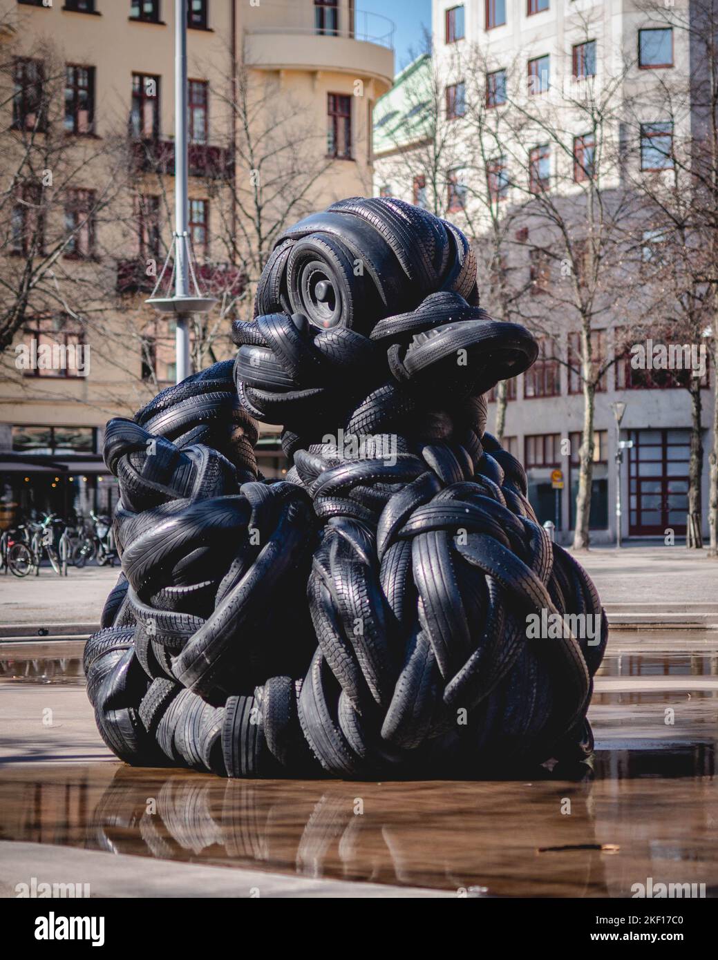 A vertical shot of the Villu Jaanisoo rubber duck statue made of old car tires as a public art piece Stock Photo