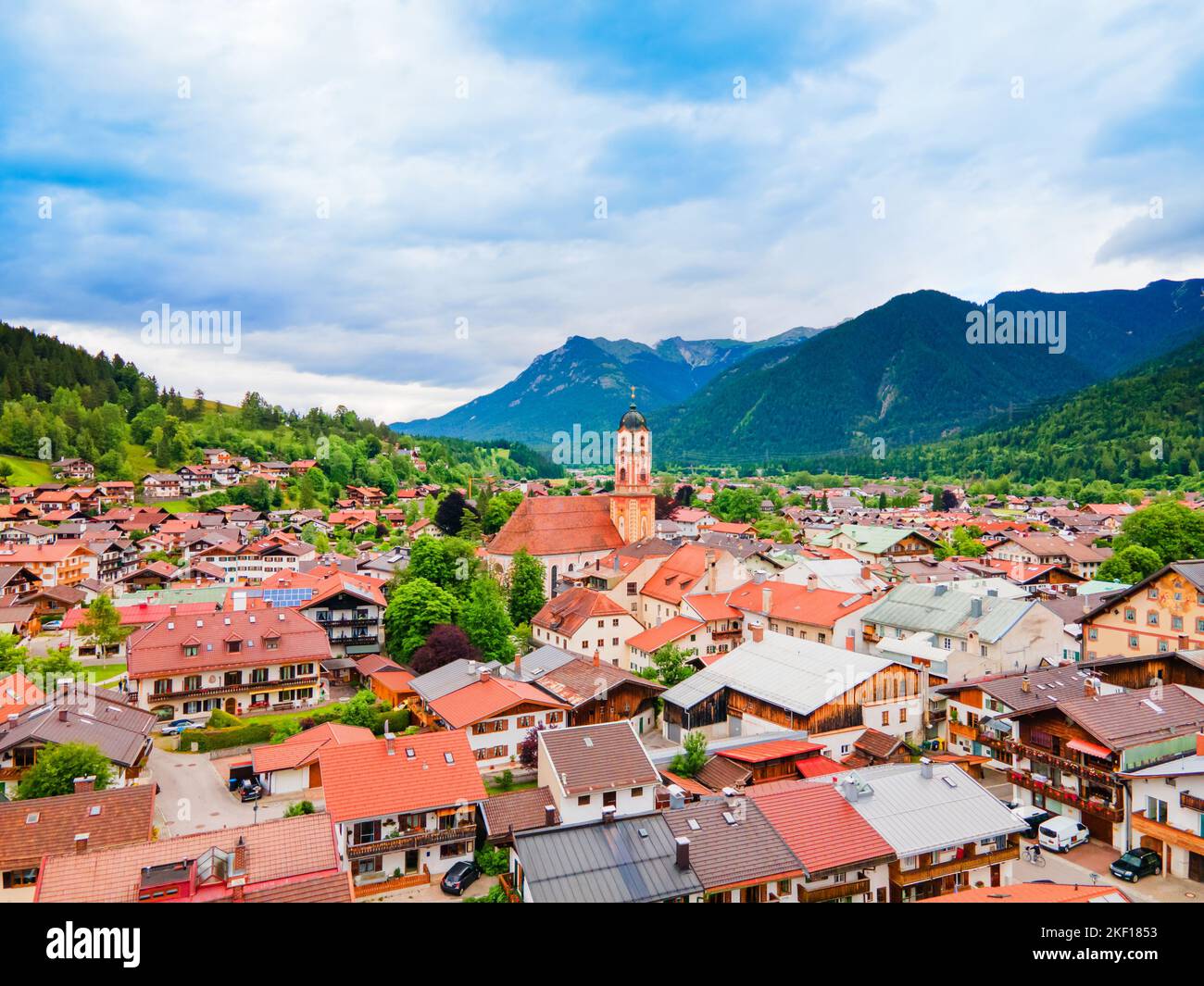 The Roman Catholic parish church of St. Peter and Paul aerial panoramic view, Mittenwald in the Upper Bavarian district of Garmisch-Partenkirchen, Ger Stock Photo