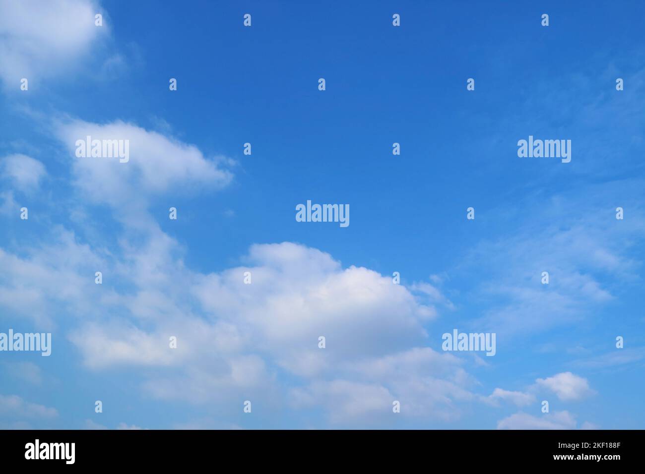 Pure White Clouds Floating on Vibrant Blue Sky Stock Photo