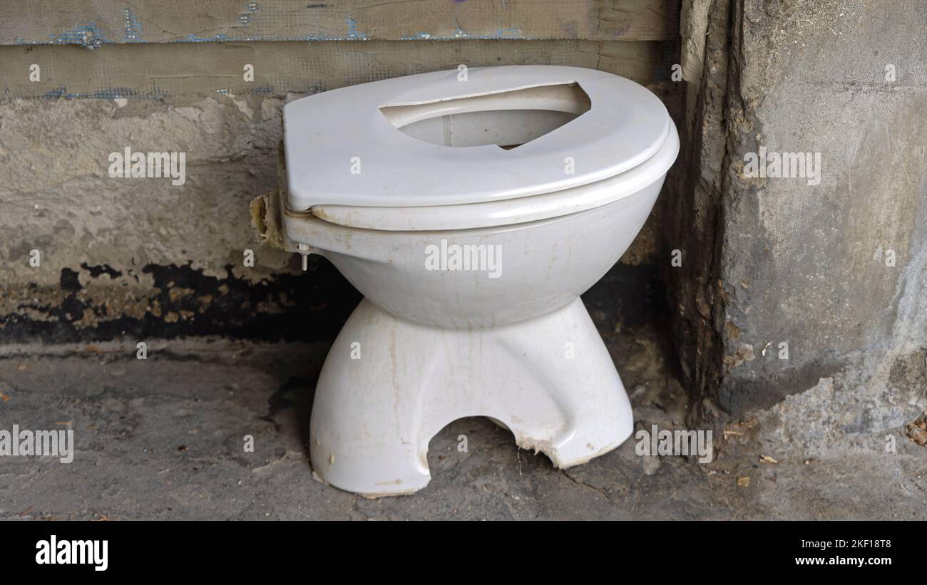 Damaged Used White Ceramic Toilet Bowl Waste Disposal Outside Stock