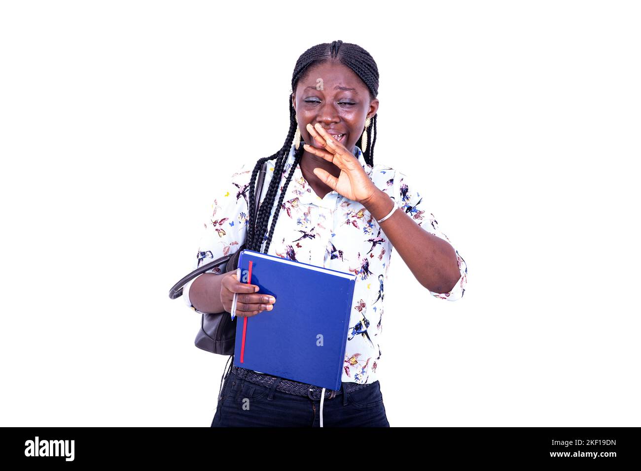 portrait of a beautiful young student woman, with a notebook and crying ...