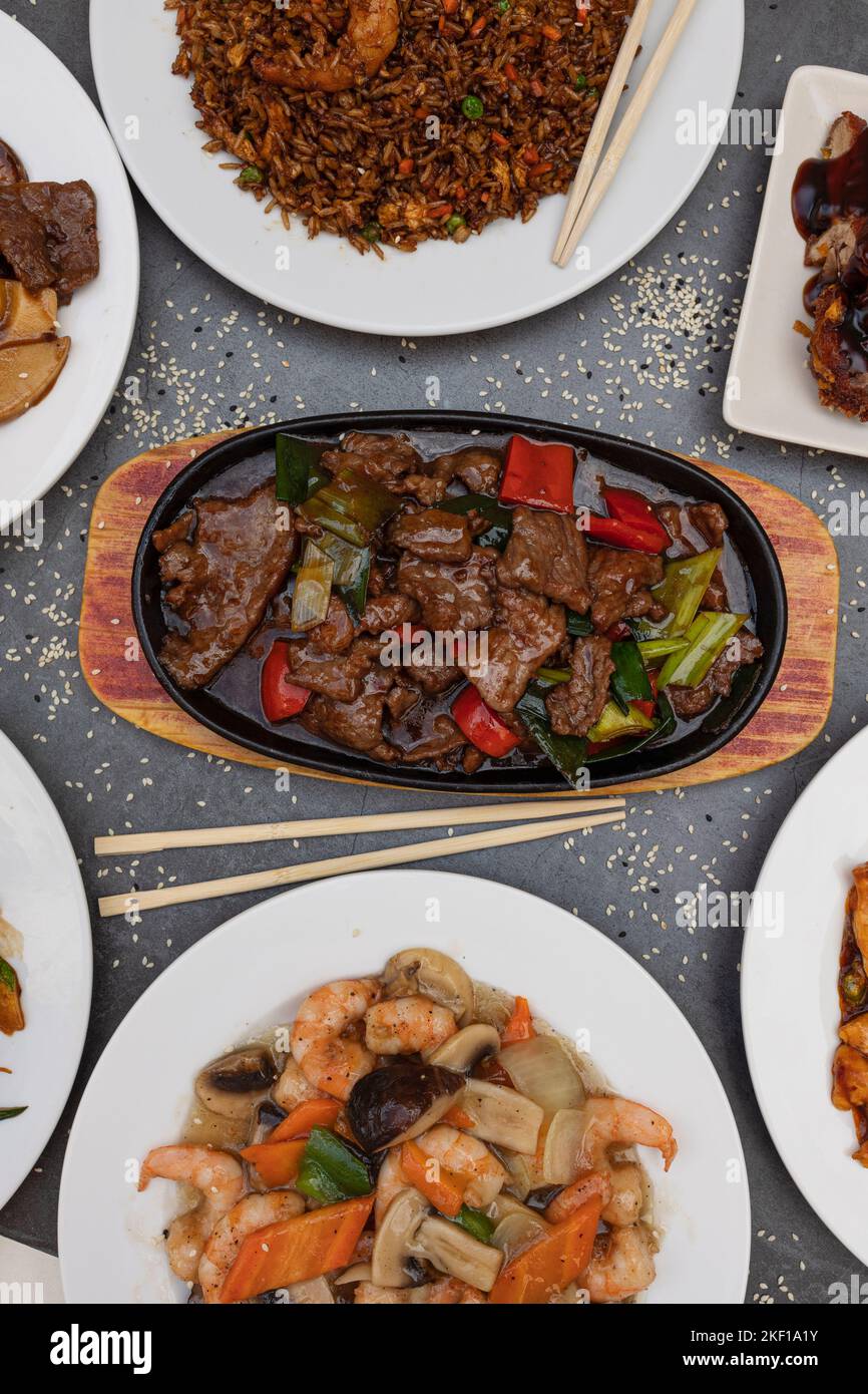 Assorted Chinese food. fried rice, dumplings, beef with oyster sauce