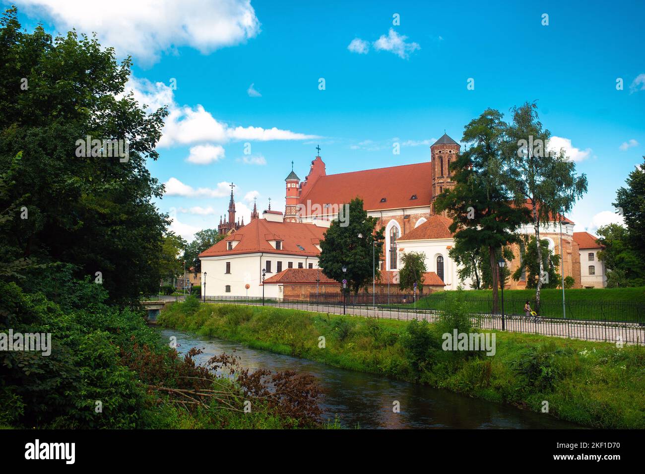 View across the river To The Roman Catholic Church Of St. Anne And The Church Of St. Francis And St. Bernard In The Old Town On A Summer Sunny Day Stock Photo
