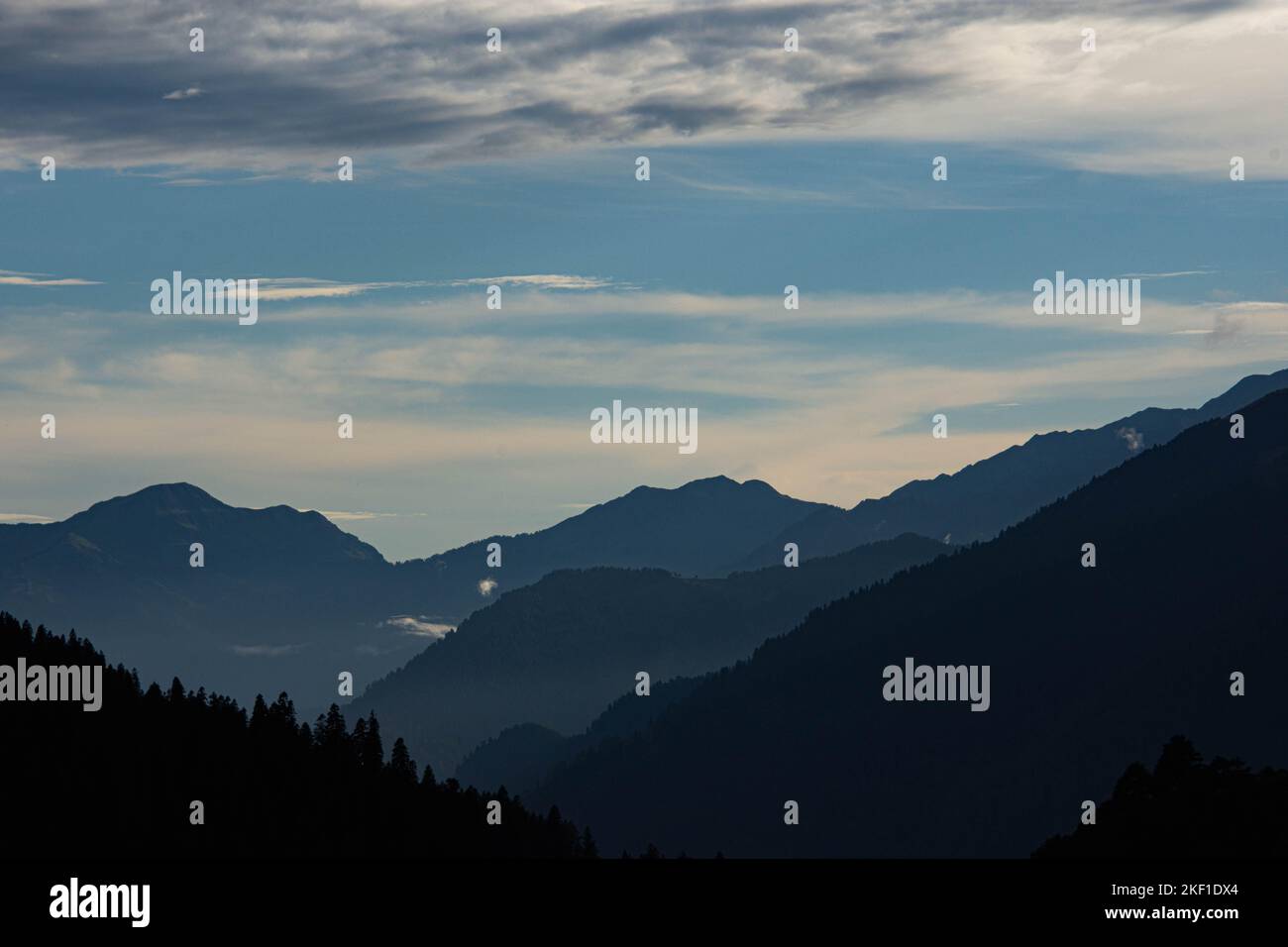 a High angle shot of clouds over mountain peak Stock Photo - Alamy