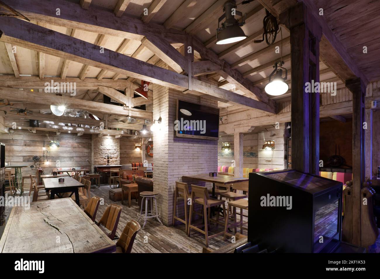 Living room of a restaurant with wooden furniture, walls, floors and