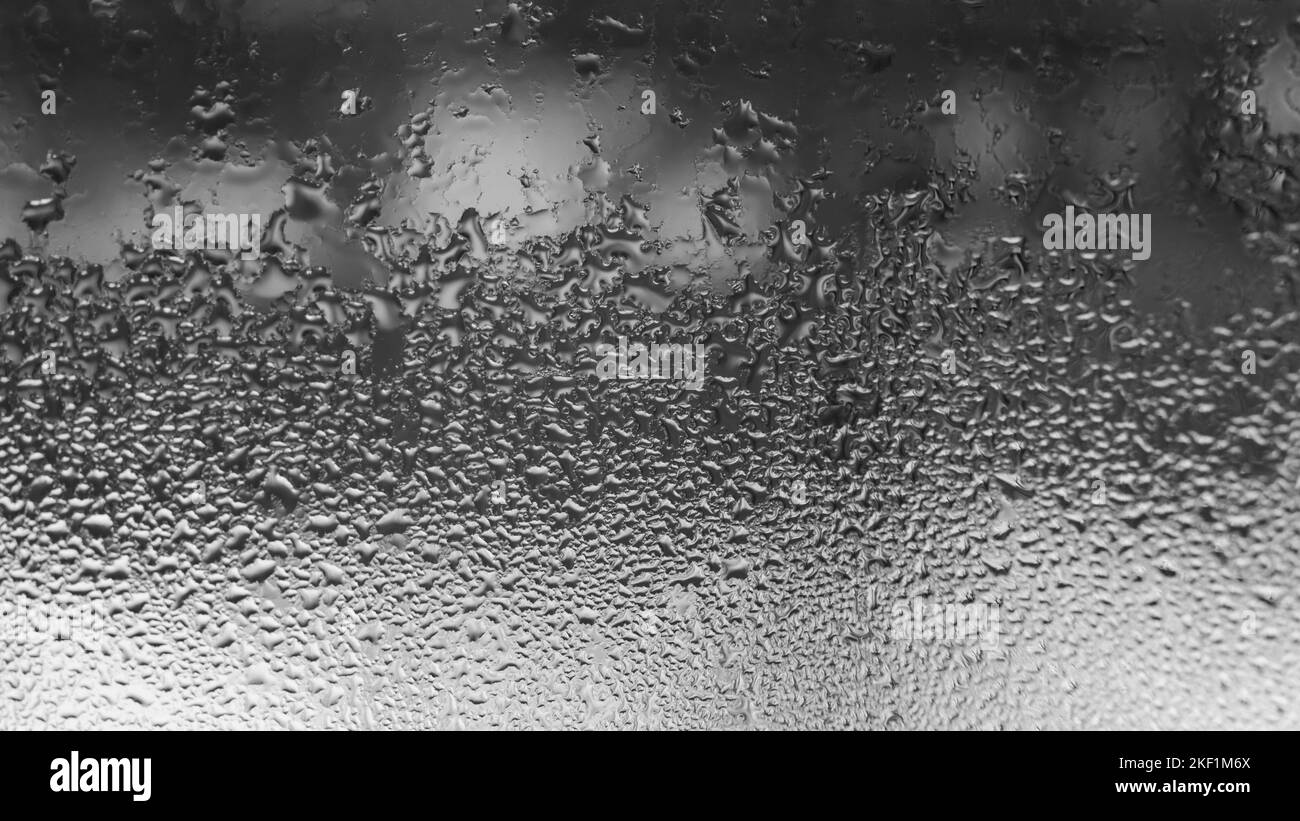 Dew drops and condensation on glass, cold season and high humidity on
