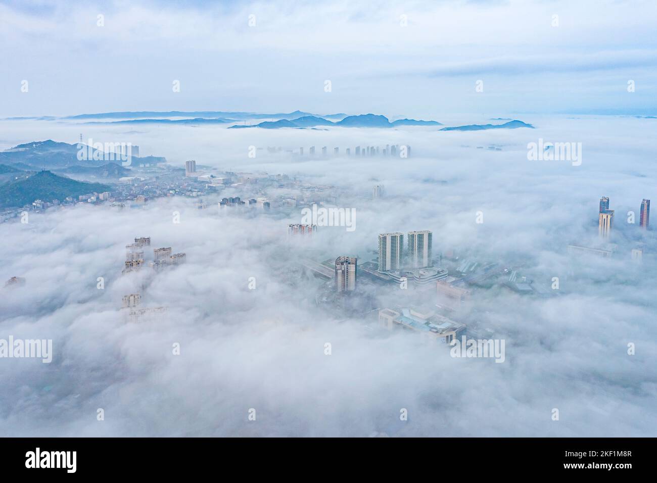 An aerial view of a modern city in the clouds Stock Photo - Alamy