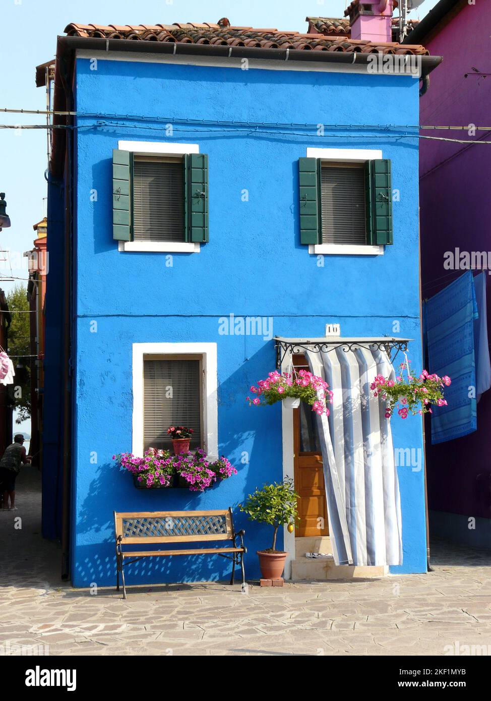 Picturesque blue house on the Venetian island Burano Stock Photo - Alamy
