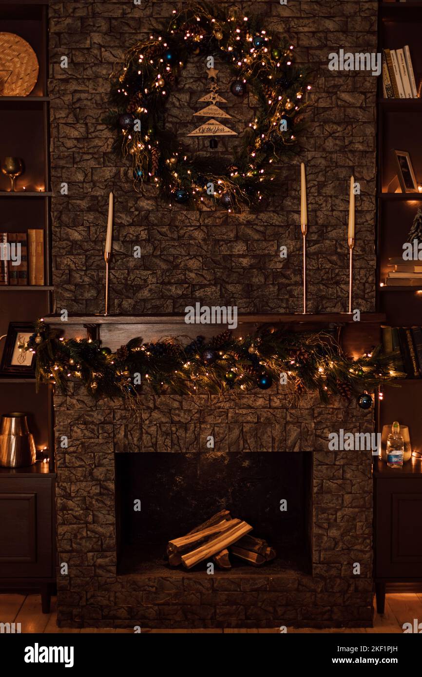 Dark brown brick fireplace in the apartment for Christmas Stock Photo