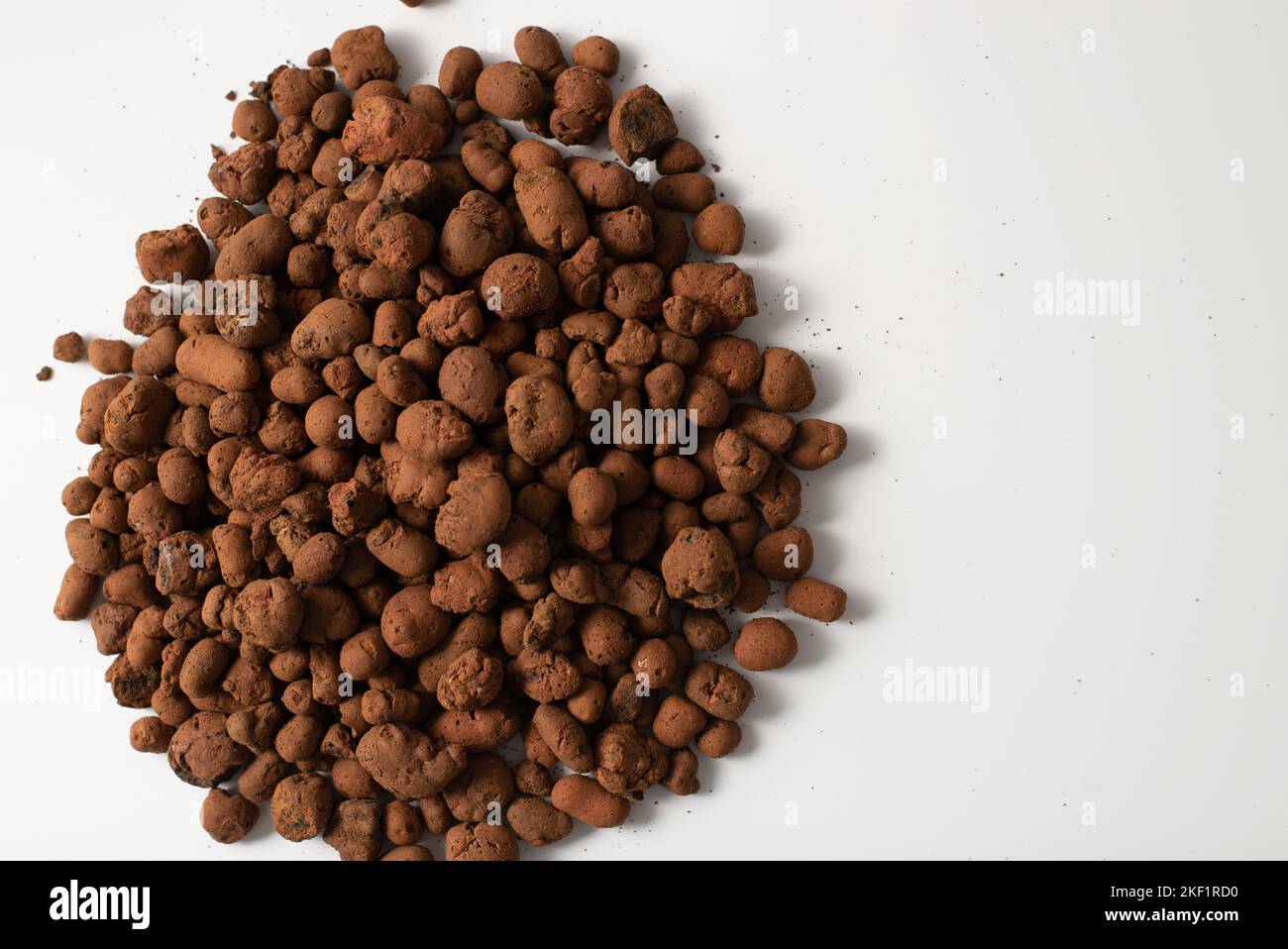 Expanded clay insulation isolated on white for transplant plant Stock