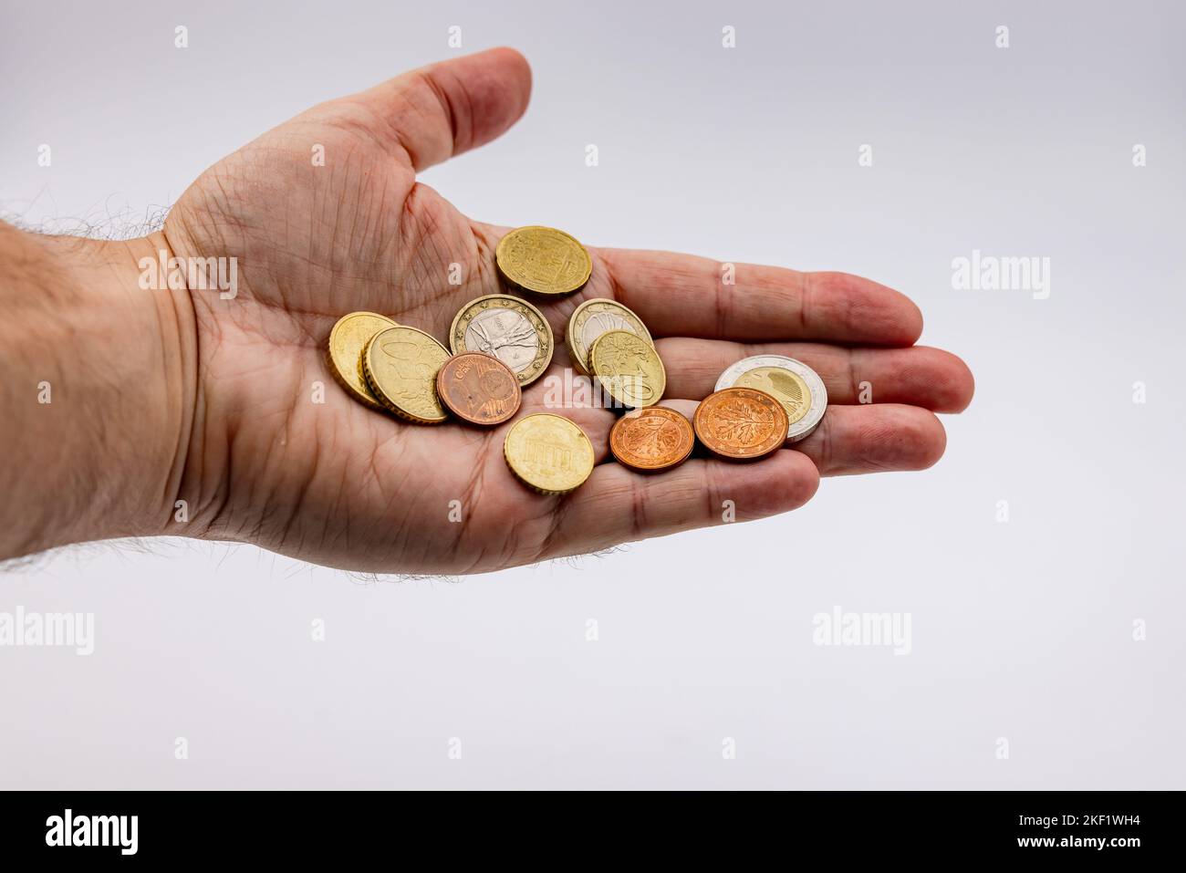 Living from hand to mouth means poverty with little euro money in coins