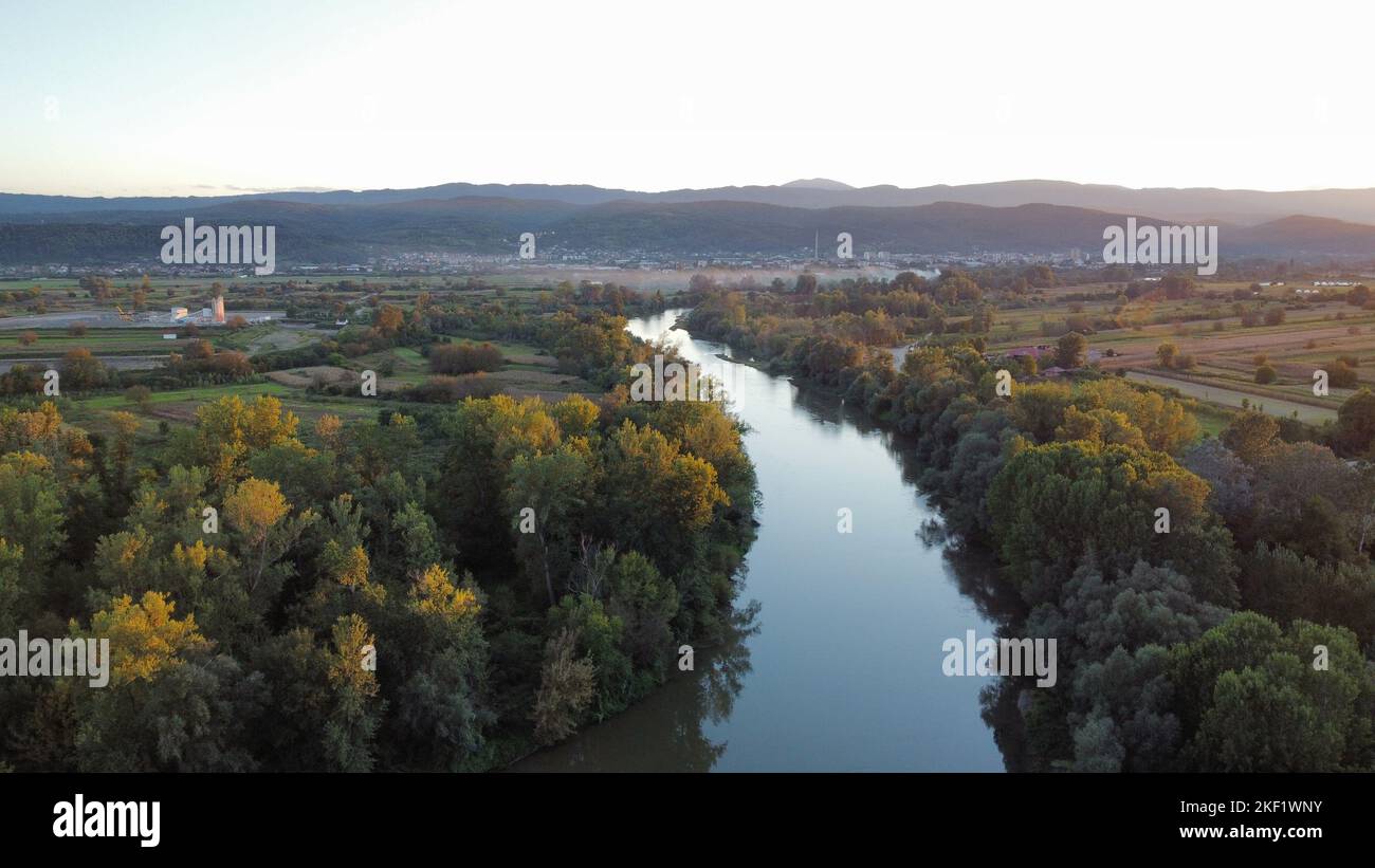 An aerial view of a deep river surrounded with dense forests Stock ...