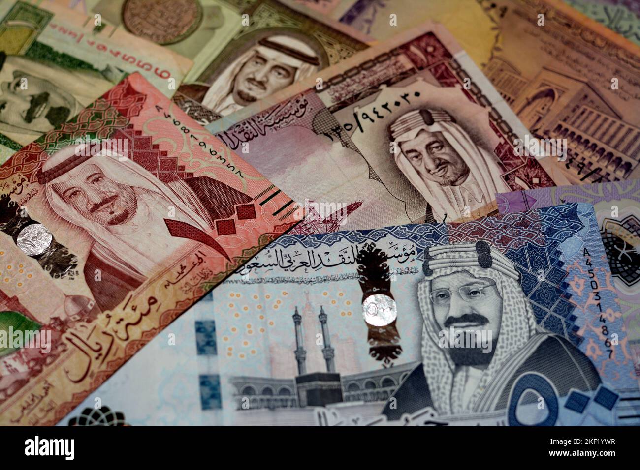 Saudi Arabia riyals money banknotes collection of different times and values feature portraits of Al Saud kings of Saudi Arabia, selective focus of Sa Stock Photo