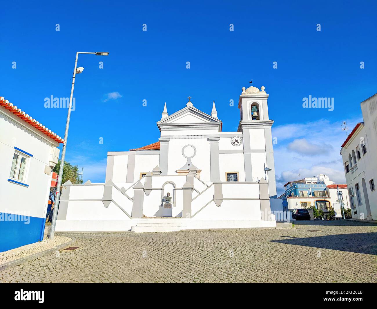 Sunny street, typical Algarve architecture, Igreja de Misericordia, Aljezur, Portugal Stock Photo