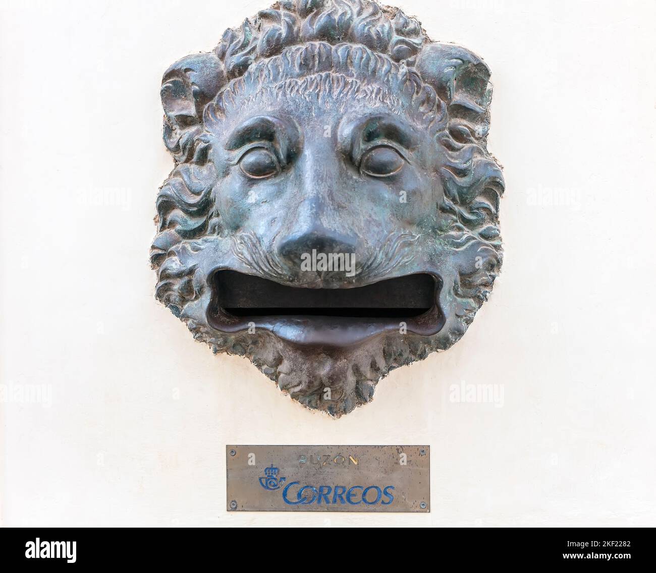 Bronze lion-head letter box Spain Stock Photo