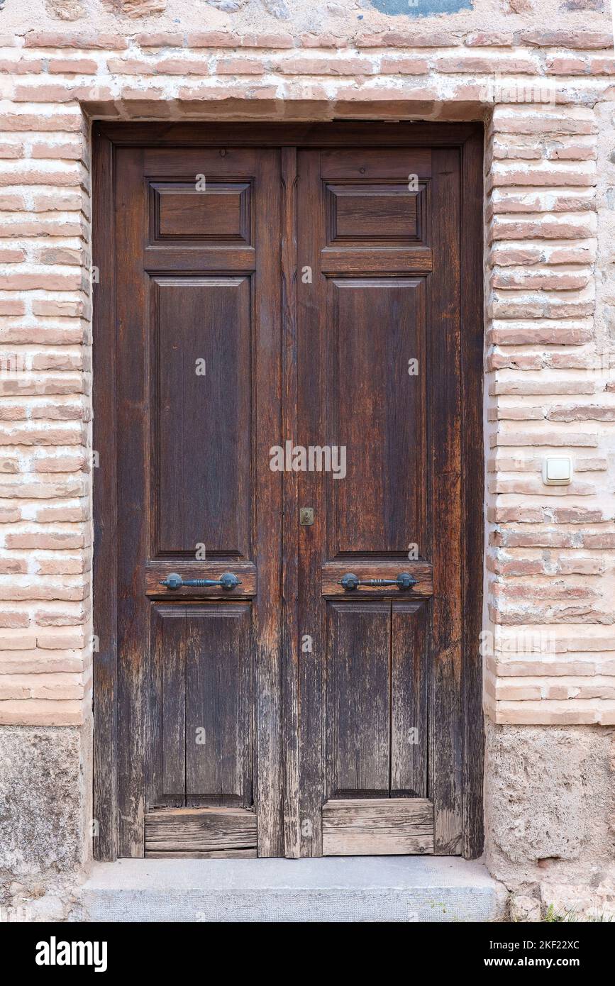 Old wooden door in a brick wall Stock Photo Alamy