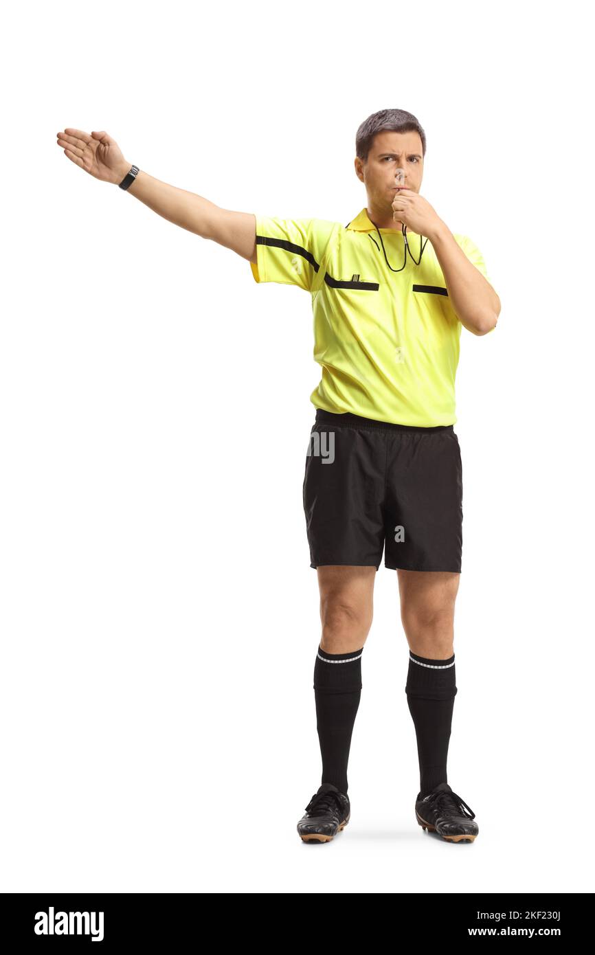 Football referee blowing a whistle and pointing with his hand isolated
