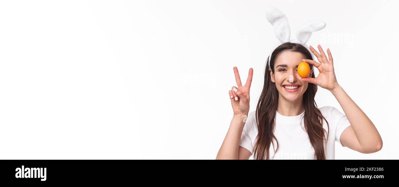 Easter, holidays and spring concept. Close-up portrait of cheerful ...