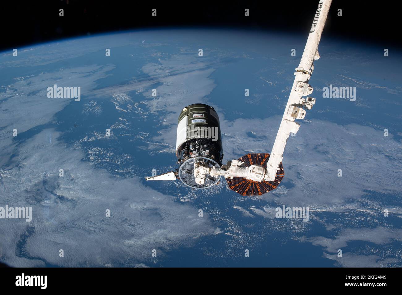International Space Station, EARTH ORBIT. 09 November, 2022. The Northrop Grumman Cygnus unmanned space freighter, in the grip of the CanadaArm2 robotic arm for docking with the Unity module at the International Space Station, November 9, 2022 in Earth Orbit. One of two cymbal-shaped UltraFlex solar arrays failed to deploy after launch but Cygnus had enough power to continue the journey to the International Space Station.  Credit: NASA/NASA/Alamy Live News Stock Photo