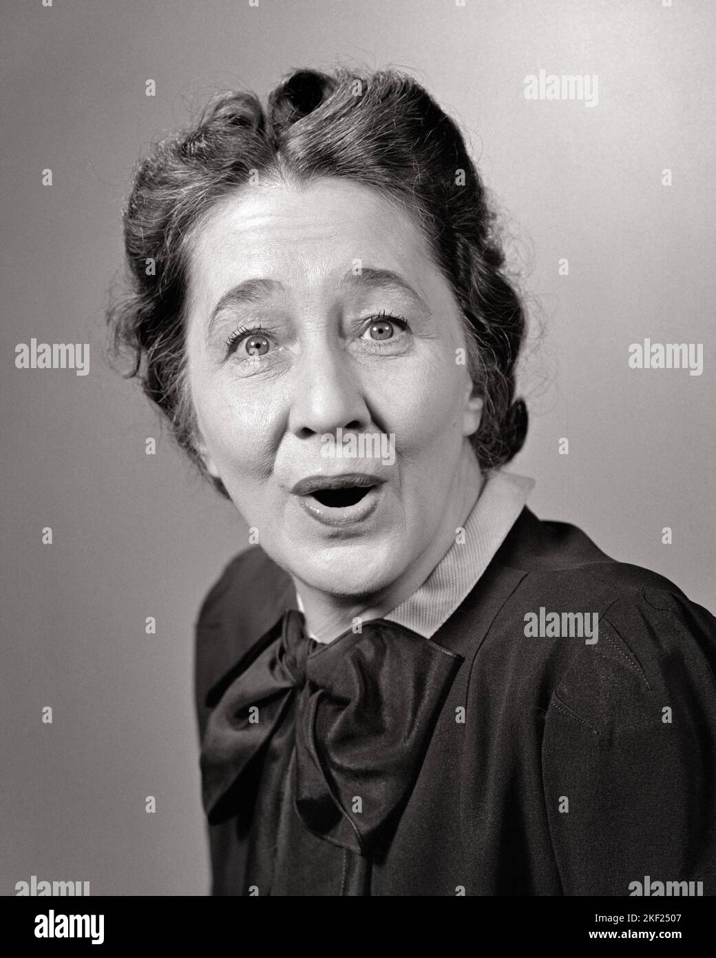 1940s PORTRAIT OF MIDDLE-AGED WOMAN SURPRISED FACIAL EXPRESSION LOOKING AT CAMERA - g262 HAR001 HARS EXPRESSIONS MIDDLE-AGED B&W EYE CONTACT SUCCESS BUG-EYED DREAMS HAPPINESS MIDDLE-AGED WOMAN HEAD AND SHOULDERS CHEERFUL DISCOVERY VICTORY EXCITEMENT OPPORTUNITY DELIGHTED FEELING SMILES CONNECTION ECSTATIC ELATED JOYFUL JUBILANT OVERJOYED THRILLED EYE-OPENER WIDE-EYED ASTONISHED EMOTION EMOTIONAL EMOTIONS AGAPE BLACK AND WHITE CAUCASIAN ETHNICITY HAR001 MOUTH OPEN OLD FASHIONED Stock Photo