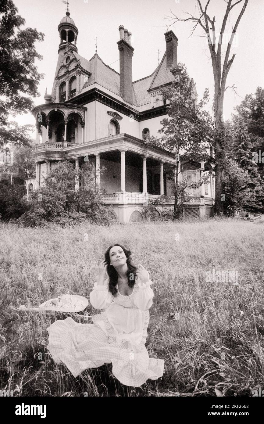 1960s 1970s WOMAN SITTING IN GRASS FRONT OF ABANDONED HAUNTED VICTORIAN HOUSE - g7915 HAR001 HARS HALF-LENGTH LADIES PERSONS RESIDENTIAL CHARACTER RISK BUILDINGS SPIRITUALITY CONFIDENCE GHOSTLY B&W SADNESS BRUNETTE DREAMS SPIRIT HAPPINESS WEIRD HIGH ANGLE PROPERTY STRANGE CREEPY EERIE EXTERIOR ABANDONED HOMES MOOD HAUNTING REAL ESTATE CONNECTION CONCEPTUAL STRUCTURES IMAGINATION RESIDENCE STYLISH UNUSUAL EDIFICE MID-ADULT WOMAN BLACK AND WHITE CAUCASIAN ETHNICITY DESERTED GOTHIC HAR001 OLD FASHIONED Stock Photo
