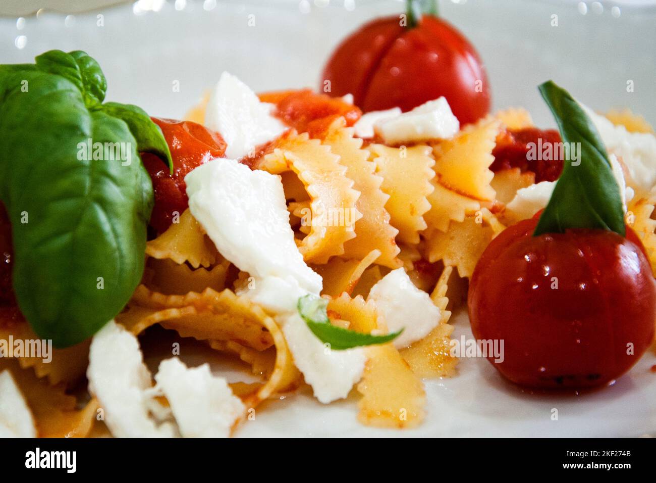 Tagliatelle alla sorrentina made with cherry tomato, mozzarella, basil and white onion, made by the chef of the city of Maddaloni (CE) Giovanna Esposi Stock Photo